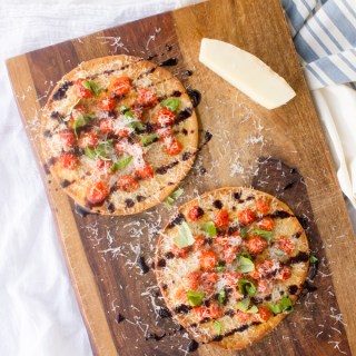 Bruschetta Pita Pizza via GalMeetsFood.com #bruschetta #pizza #recipes